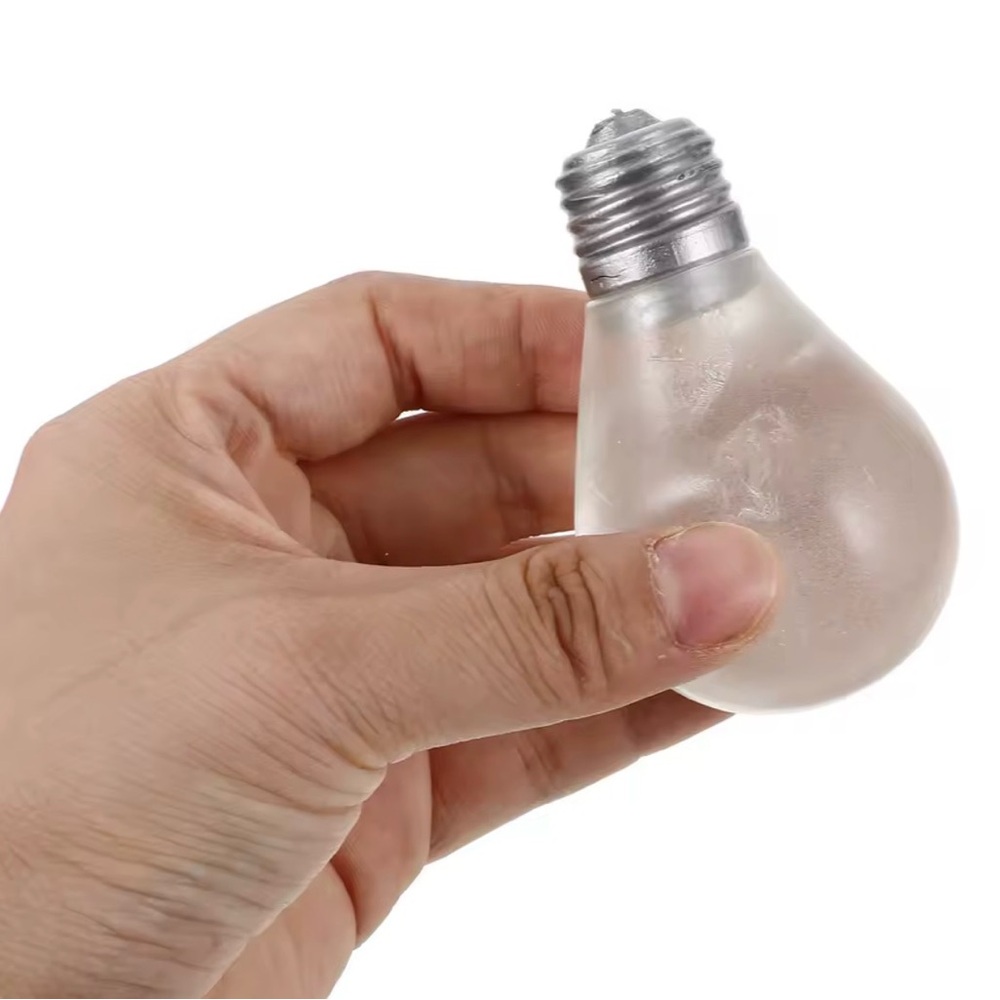 light bulb-shaped squishy toy black light turns green